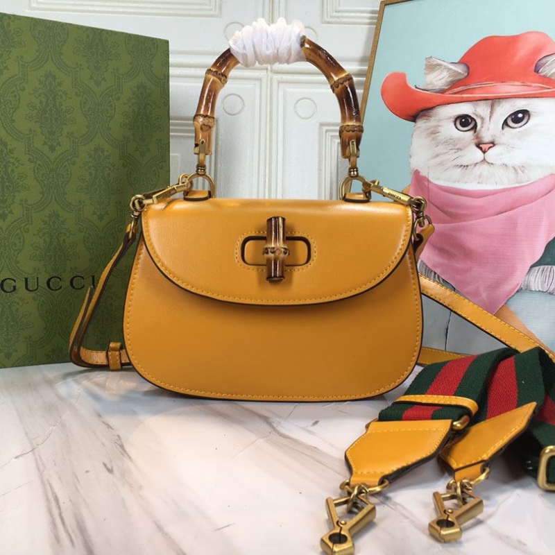 G*u*i top handle bags
